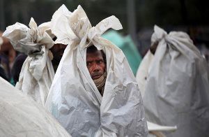 A guy covered with a bag